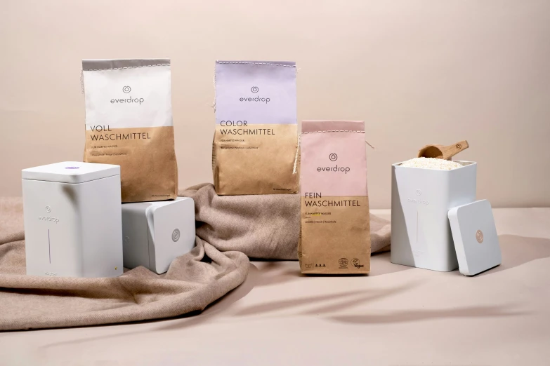 coffee bags and boxes that are on a cloth