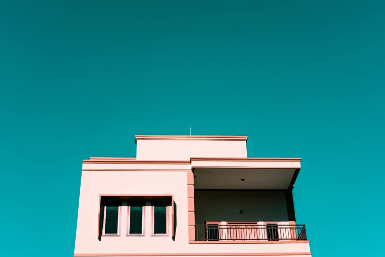 a tall building with a sky in the background