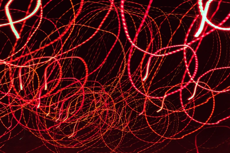 lots of red light streaks on a dark background