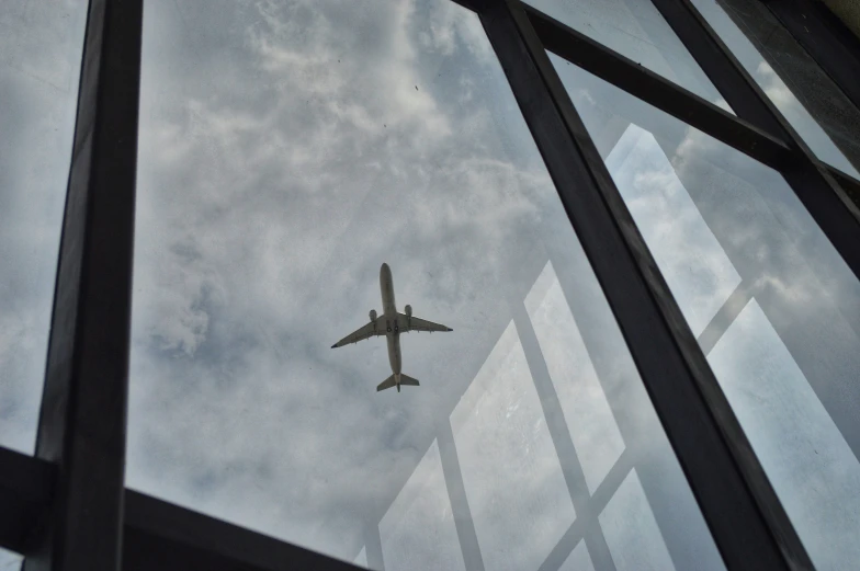 an airplane in the air seen through a window