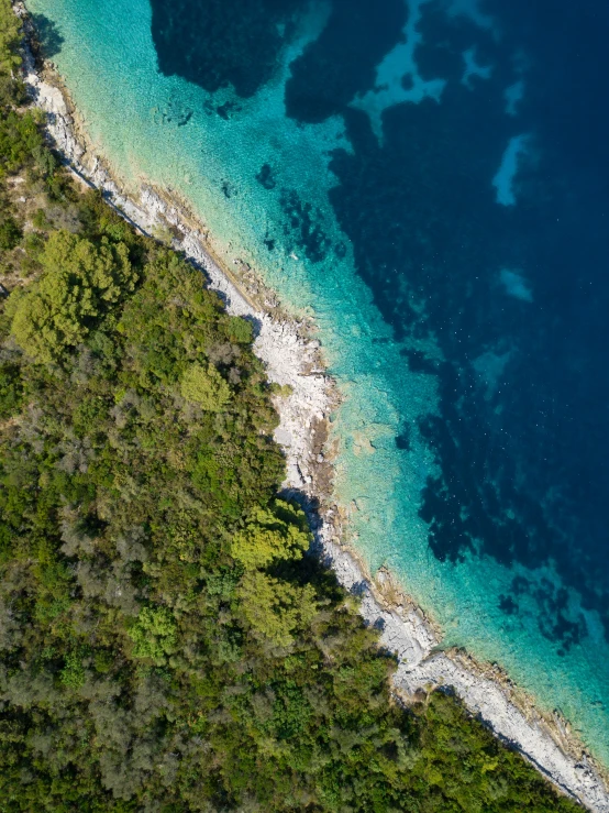 an aerial view of a clear blue sea