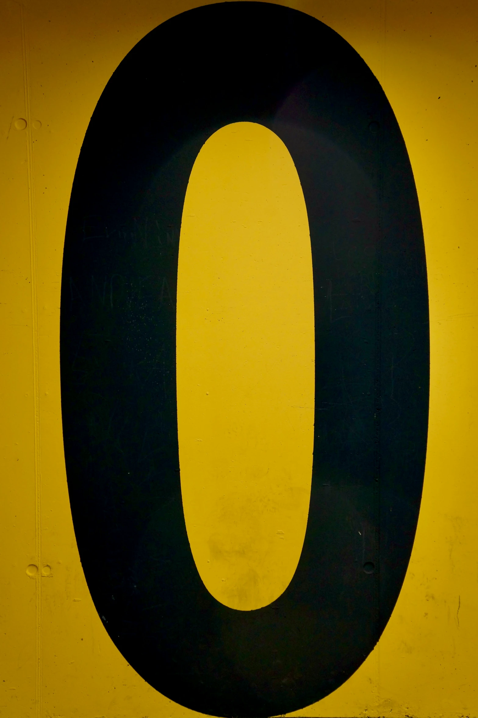 a number ten sign on a yellow wall