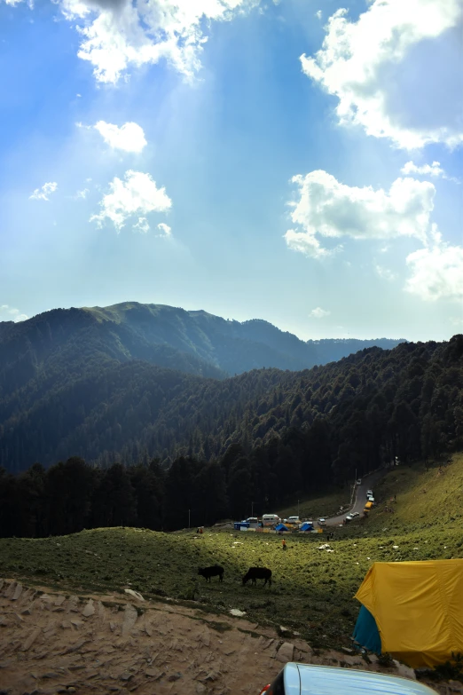 a mountain range that is covered in tents and water