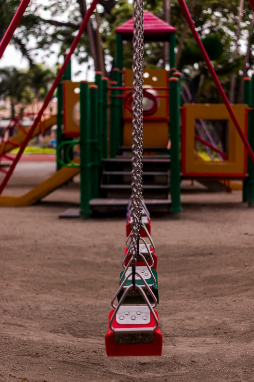 a park with a swing and slide