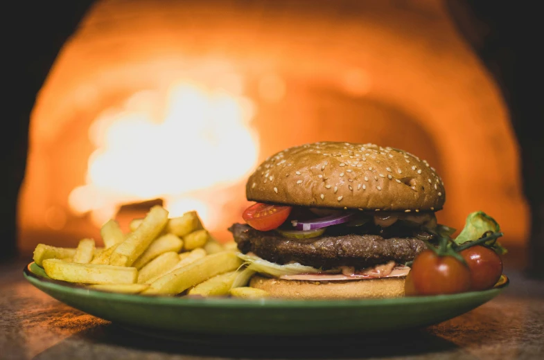 the burger has french fries on the table