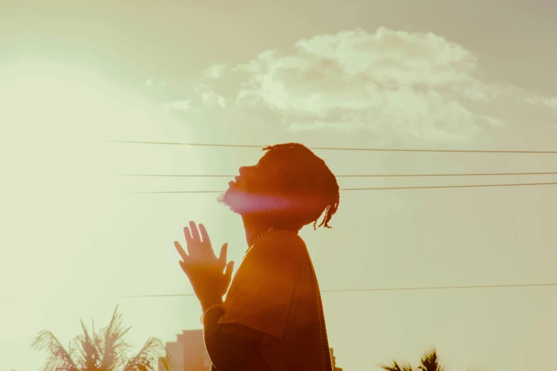 silhouette of person and clear sky and white clouds