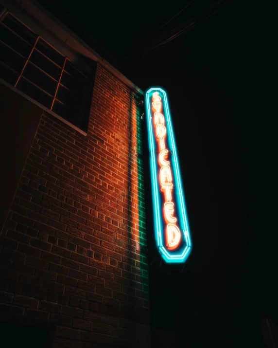 neon signs on the side of a building