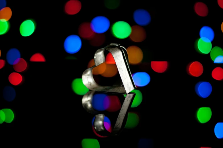 a closeup of a ring on a table in a dark room