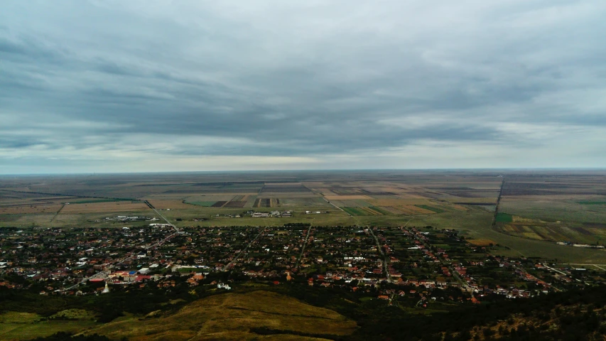 the city is on a hill on a cloudy day