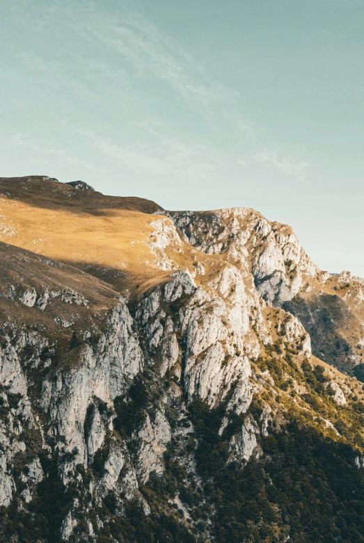 the mountains have brown grass in them and brown grass