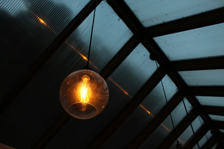 a light hanging from the ceiling above it
