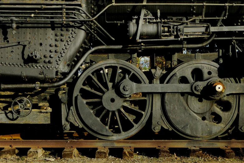 there is an old rusty train sitting on the rails