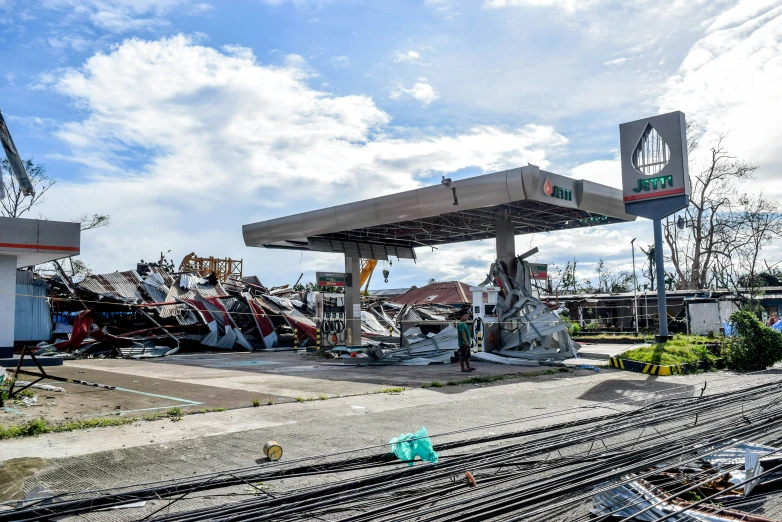 a train passing through an empty gas station