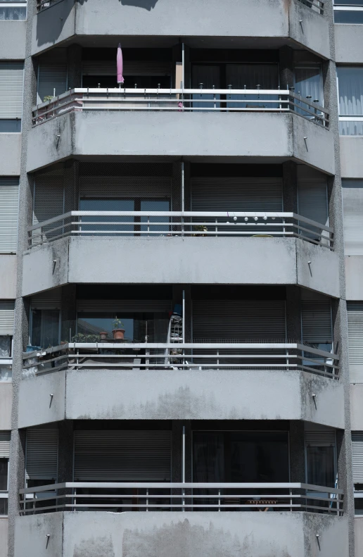 the building has many balconies on the upper stories