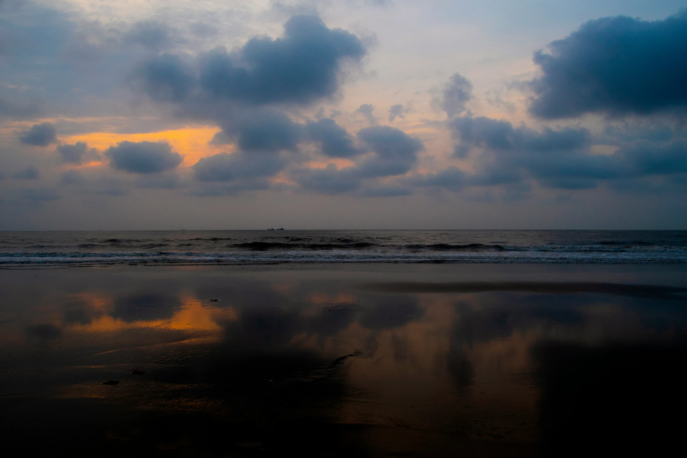 a sky view with clouds and the ocean in background