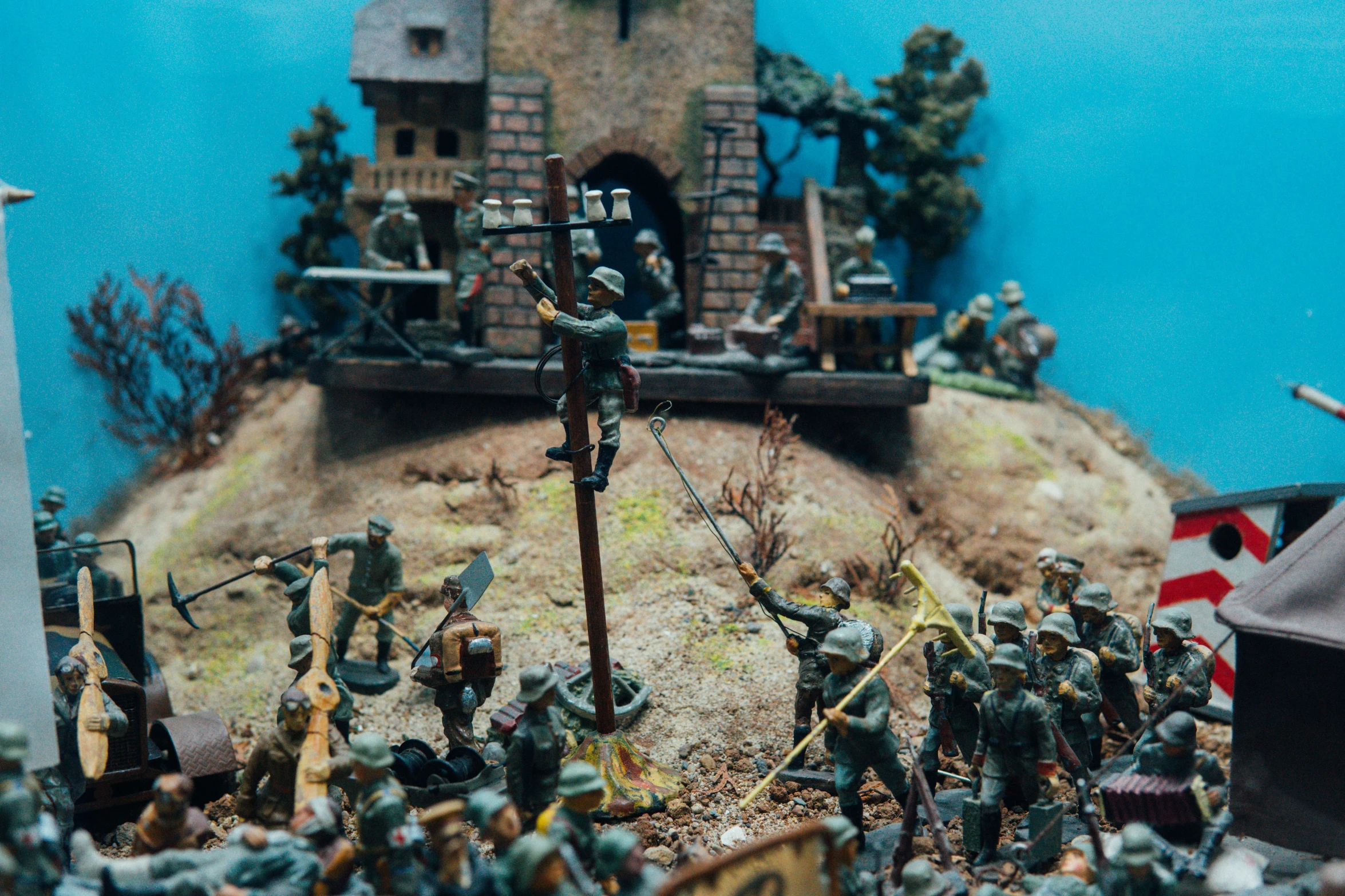 many toy soldiers standing around a clock tower