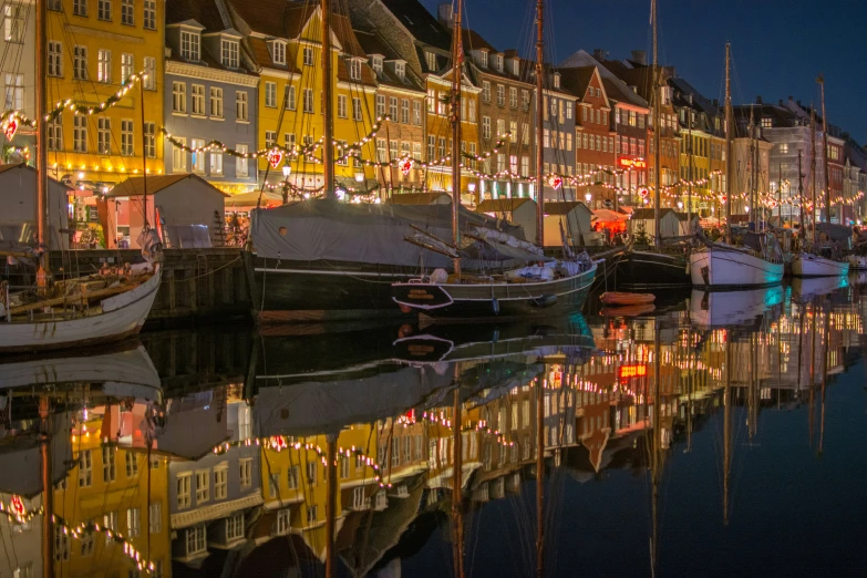 a canal full of boats lined up on the edge