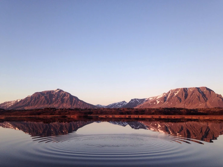 some water some mountains and snow capped mountains