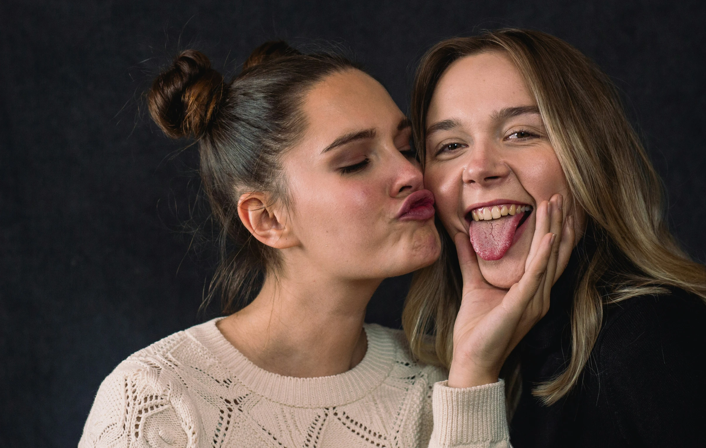 two beautiful woman sharing an excited face