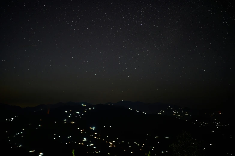 night sky and stars over the mountain range