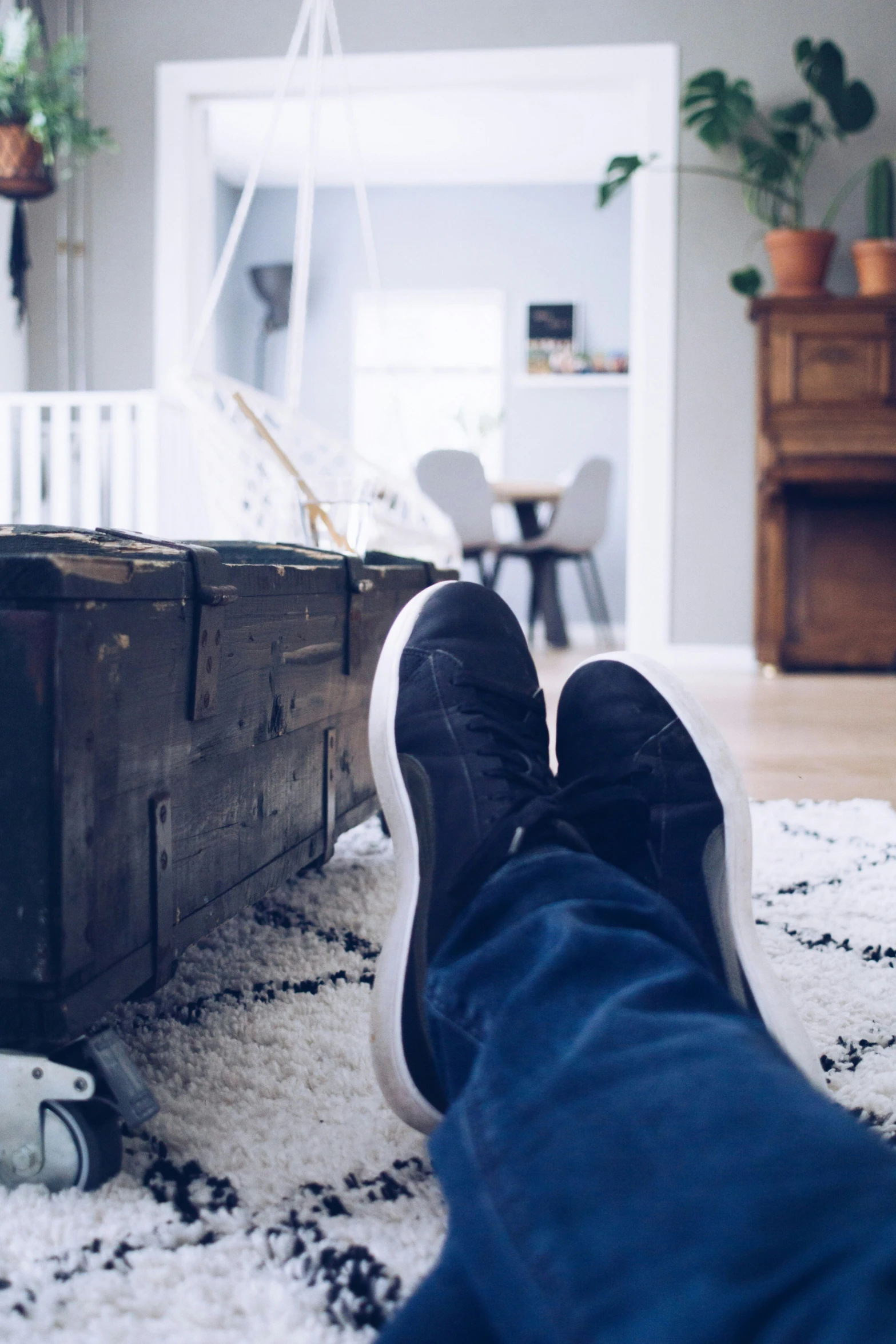 a person sitting on top of a rug on top of a floor