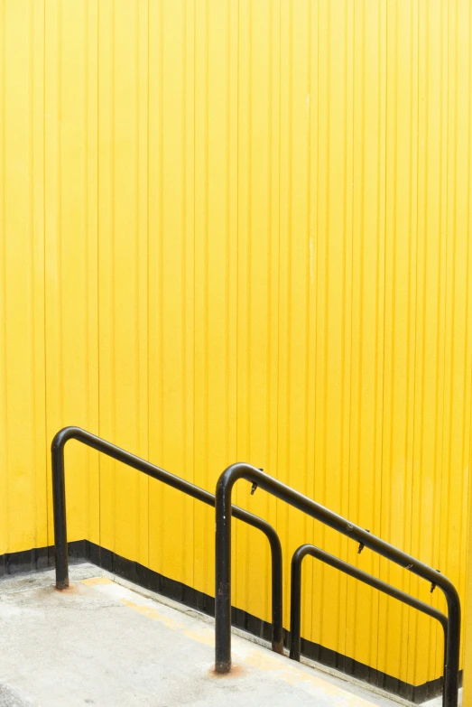 this yellow wall is a part of a building