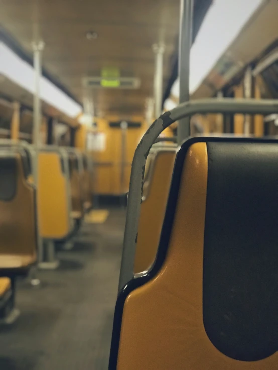 a view of a empty seat of a commuter train
