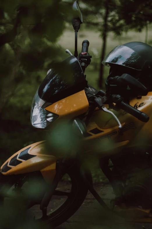 there is a motorcycle that has some black and yellow paint on it