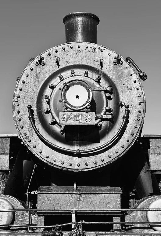 the rear of an old locomotive car with the number 545