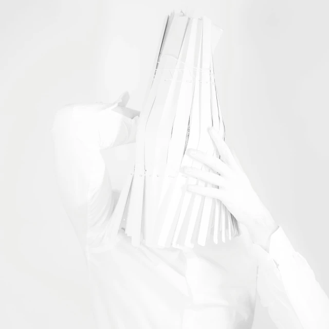 the back of a woman holding up her white shirt