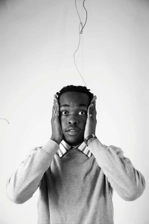 black and white pograph of a man with headphones on