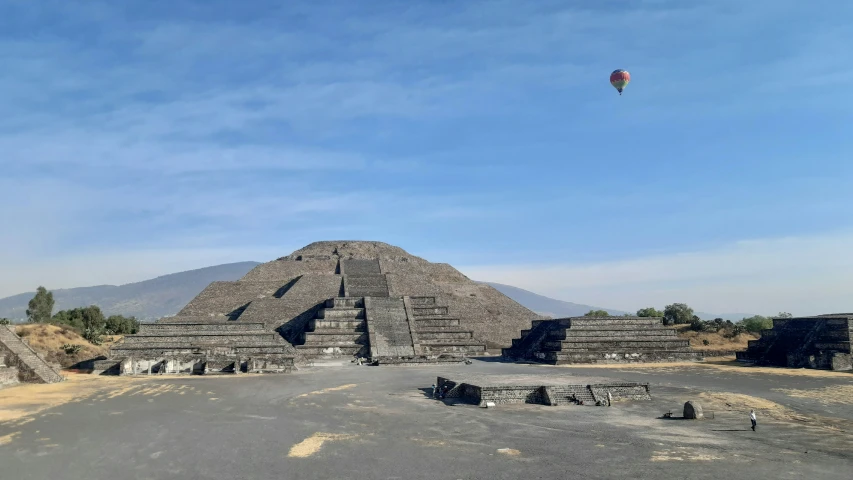 a small group of structures at the top of a hill