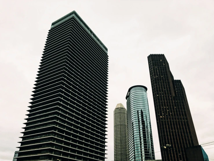 a street scene with tall buildings in the city