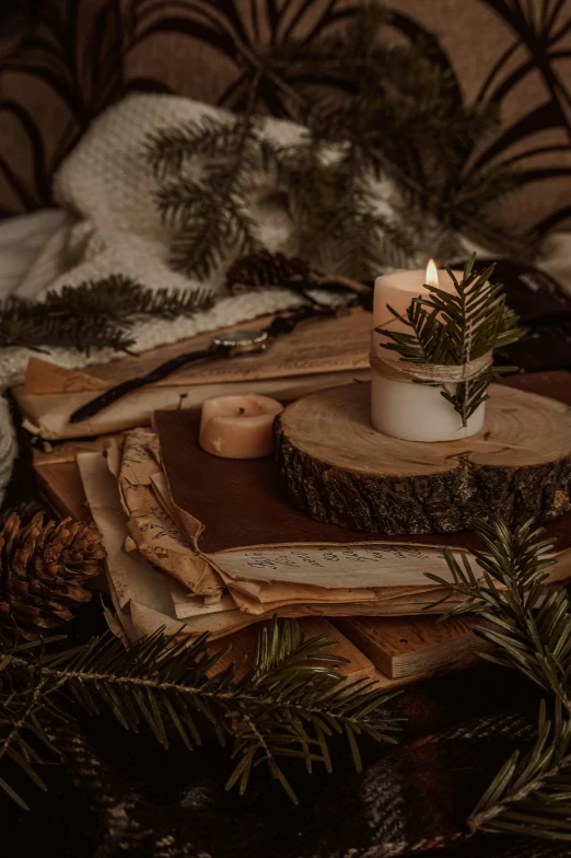 a wooden table with candles, a vase and other items