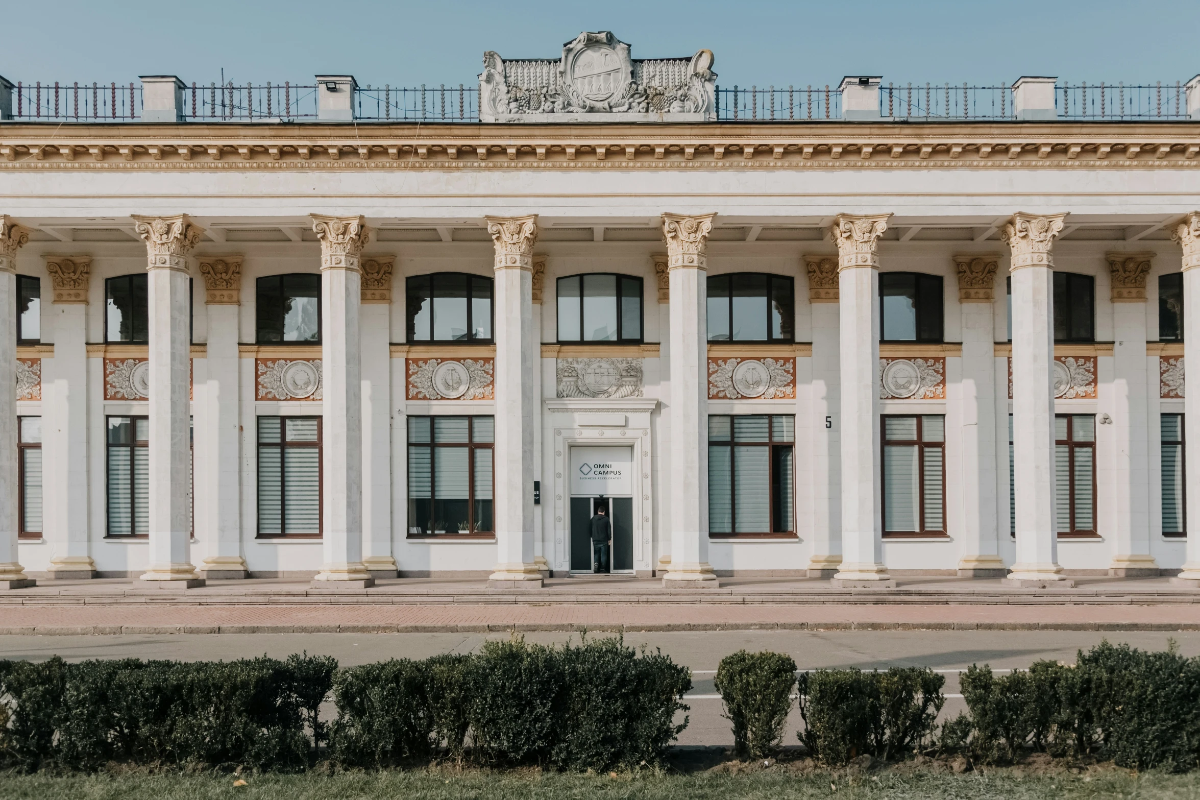 the front side of an old building with columns