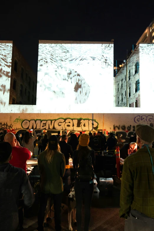 a group of people standing around near a building