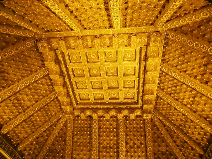 a ceiling made out of large, decorative designs