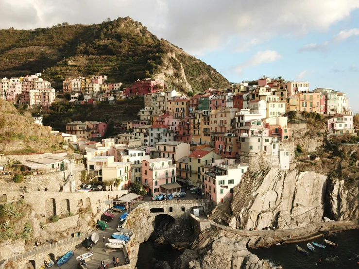 a group of buildings perched on the cliffs of a village