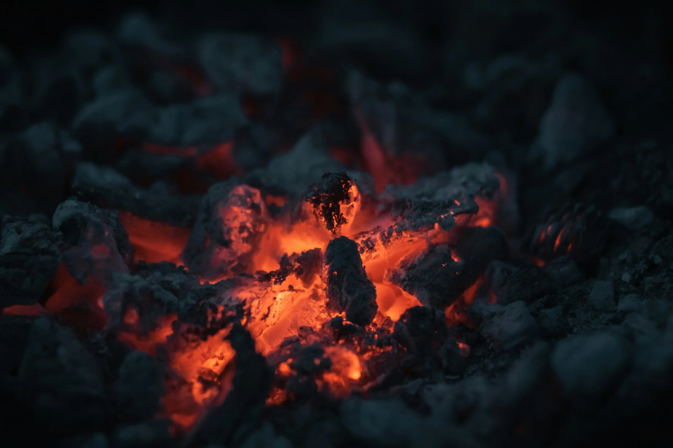 a close up view of a large flame and rocks