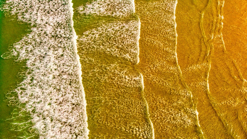 three vertical images of waves, each with a color of yellow, green, and white