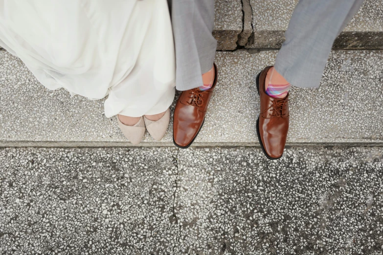a couple's feet and feet on the steps