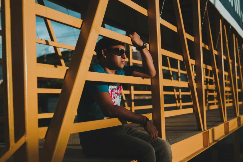 a man that is sitting down in some stairs