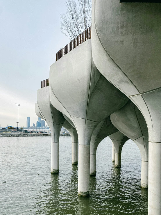 a couple of pillars sticking out over a body of water