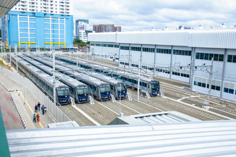 a train station with several buses parked at them