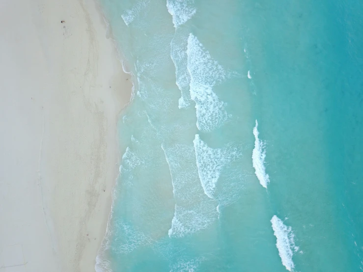 an aerial view of the beach and the ocean