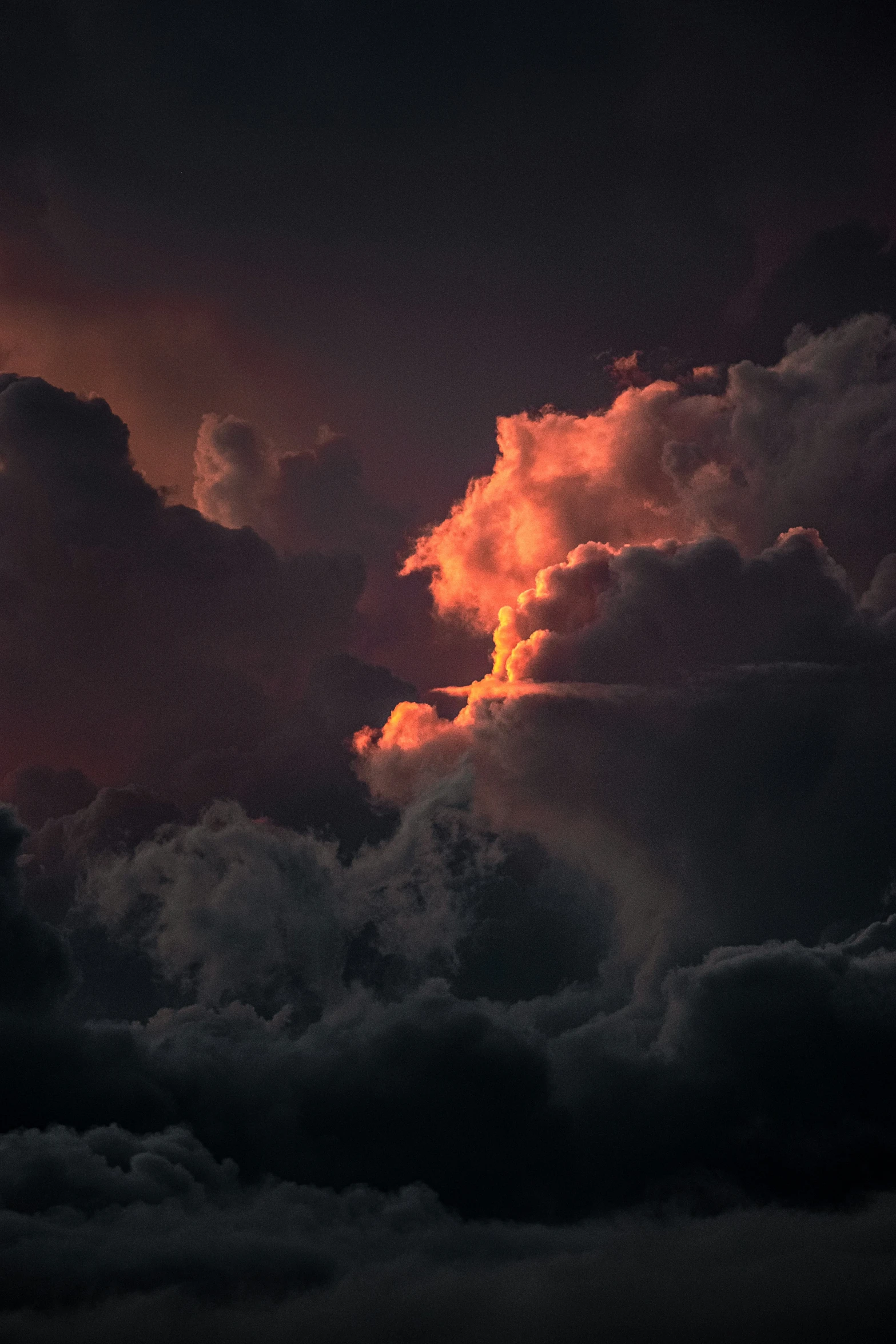 the sky during an extreme sunset shows many clouds