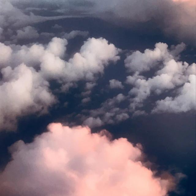 a view from an airplane's window looking over clouds