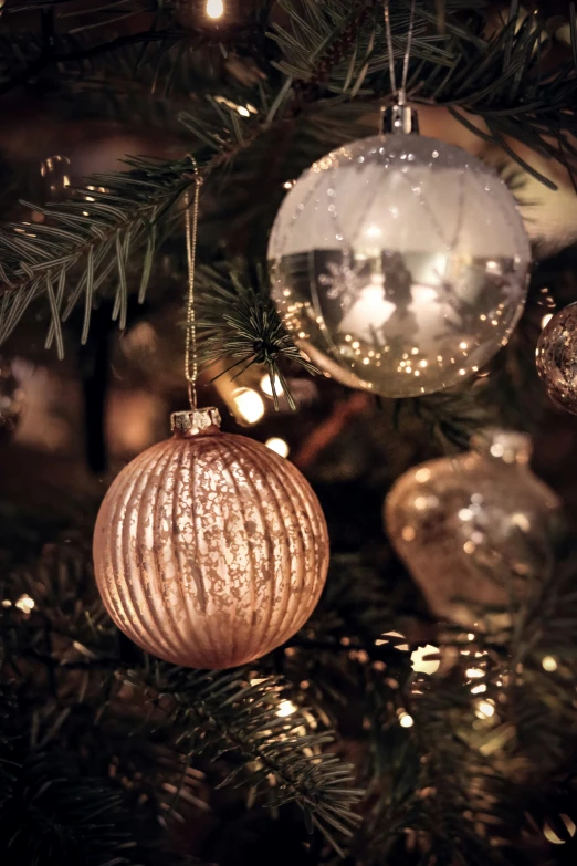 a tree with ornaments and lights on it