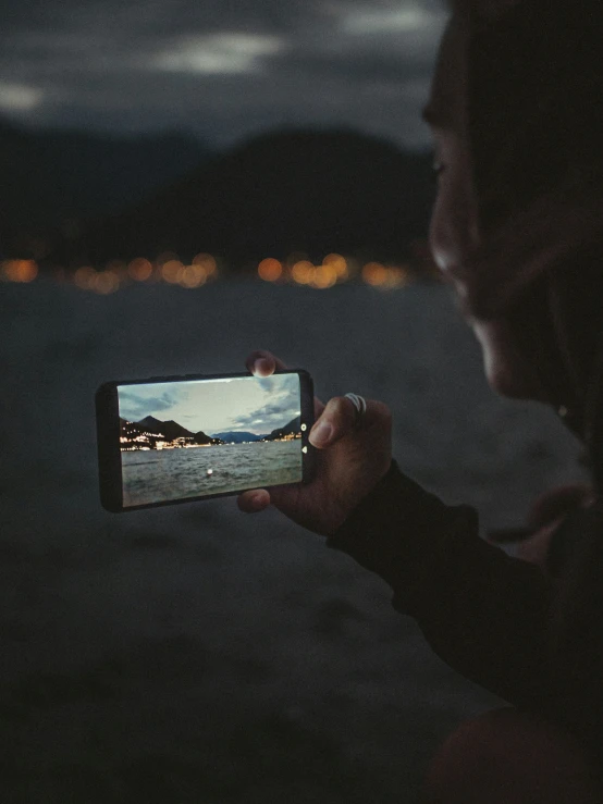 a person is taking a picture with a cell phone