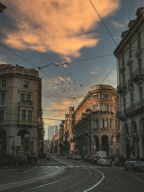 a street with traffic on it with power lines above the road